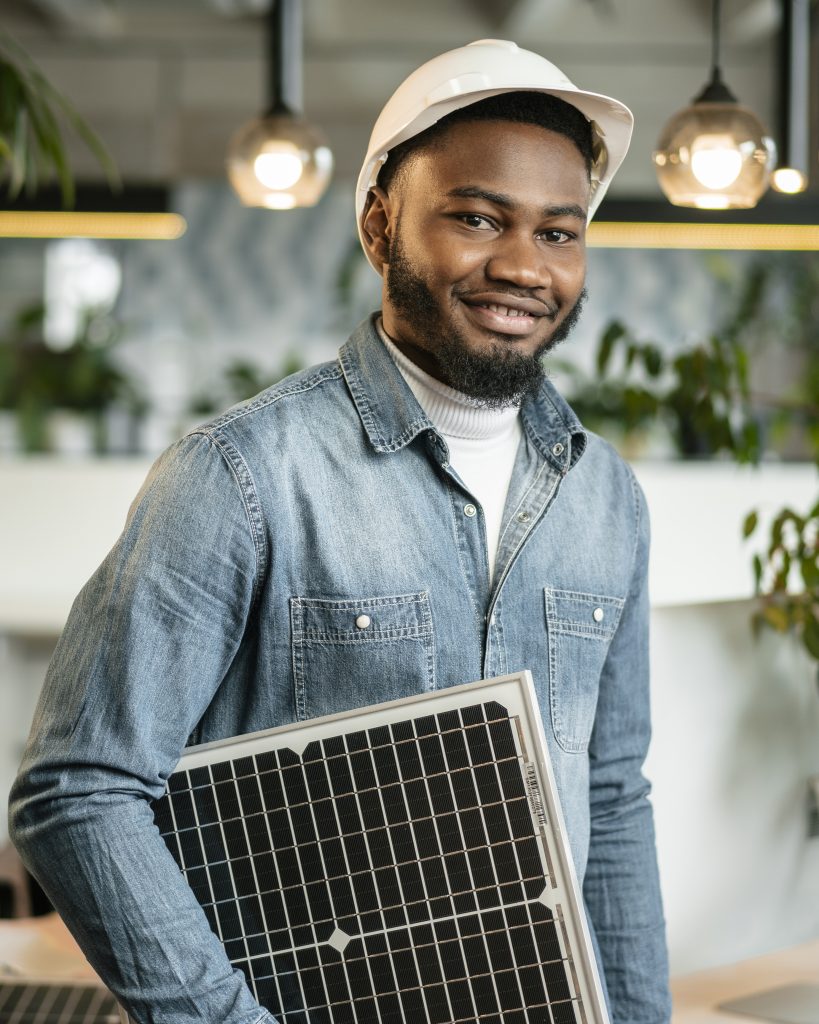 smiley man posing with helmet